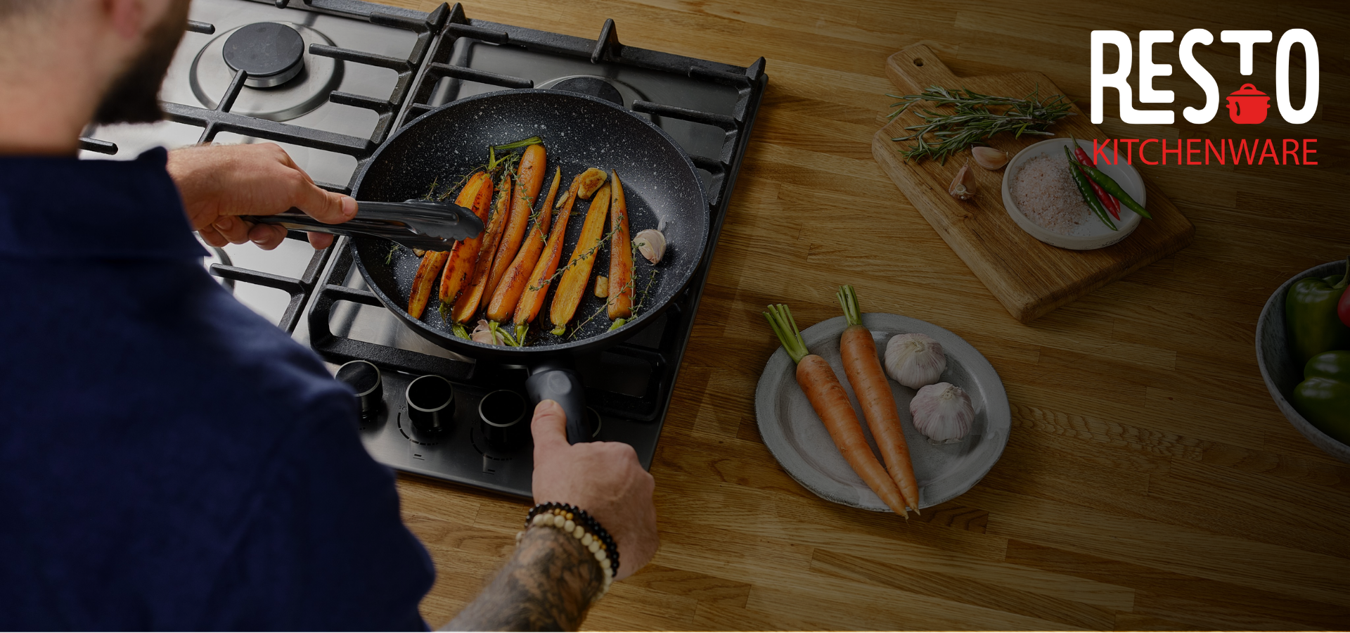 Person cooking carrots in a pan on a stove with 'RESTO' kitchenware branding.